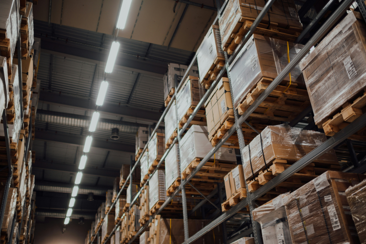 Brown cardboard boxes on white metal rack